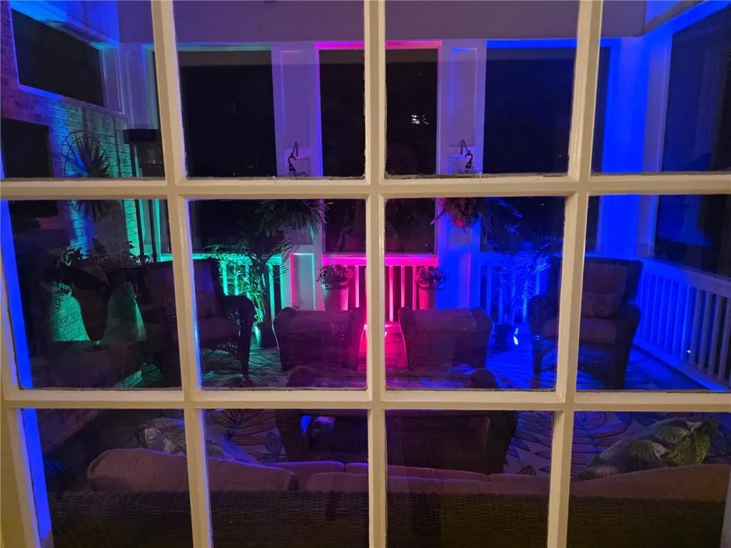 View from the Breakfast Room of the Screened-in Patio at night.