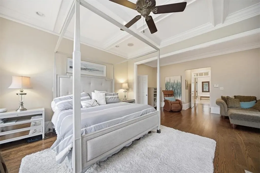 Another view of the Primary Bedroom on the main, showing a cozy seating area.