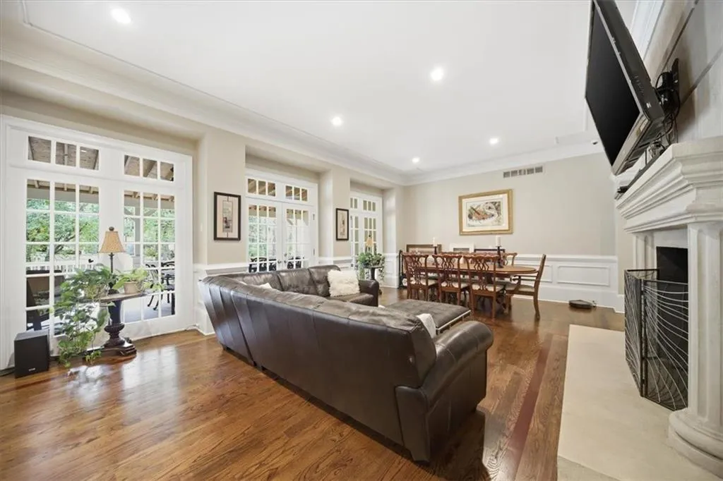 Family Room features the 3rd of the 6 fire places in this home, and has enough space to hold an 8 person Dining Room Table.