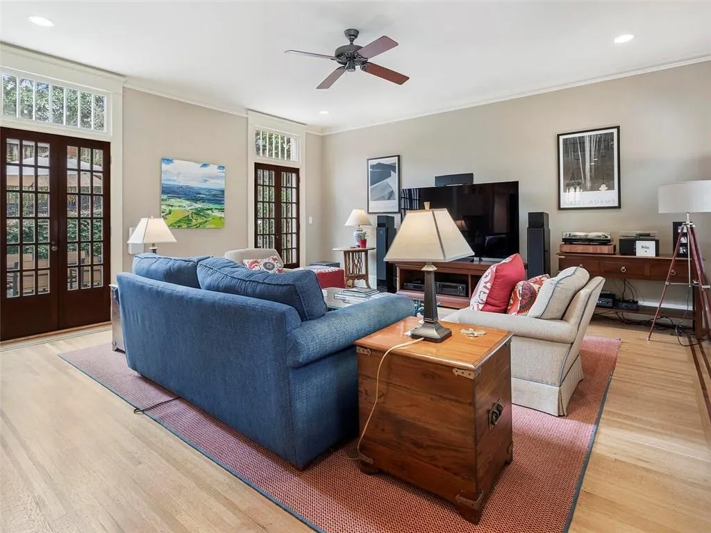 Living area featuring recessed lighting, a ceiling fan, french doors, light wood finished floors, and crown molding