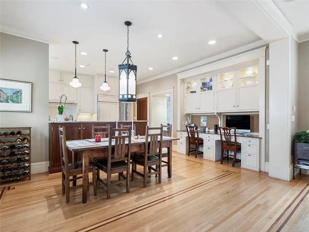 Dining space featuring ornamental molding, light wood-style flooring, and recessed lighting