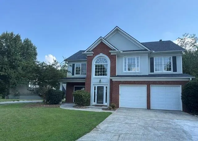 Brick and siding exterior with a gabled roof