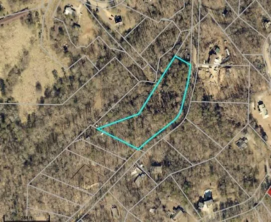 Aerial view of property's location featuring property parcel outlined