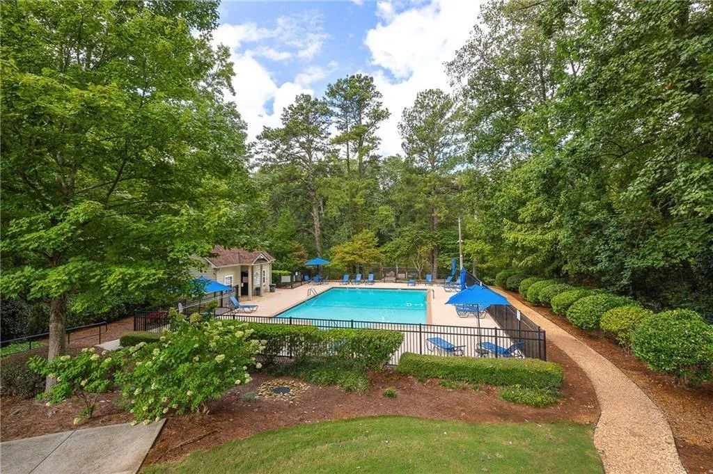 Community pool featuring a patio