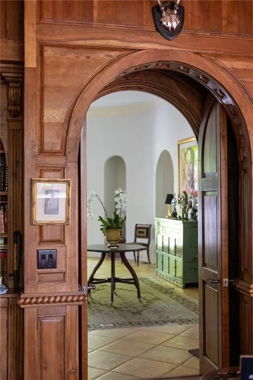 Hallway featuring mahogany wood and marble flooring