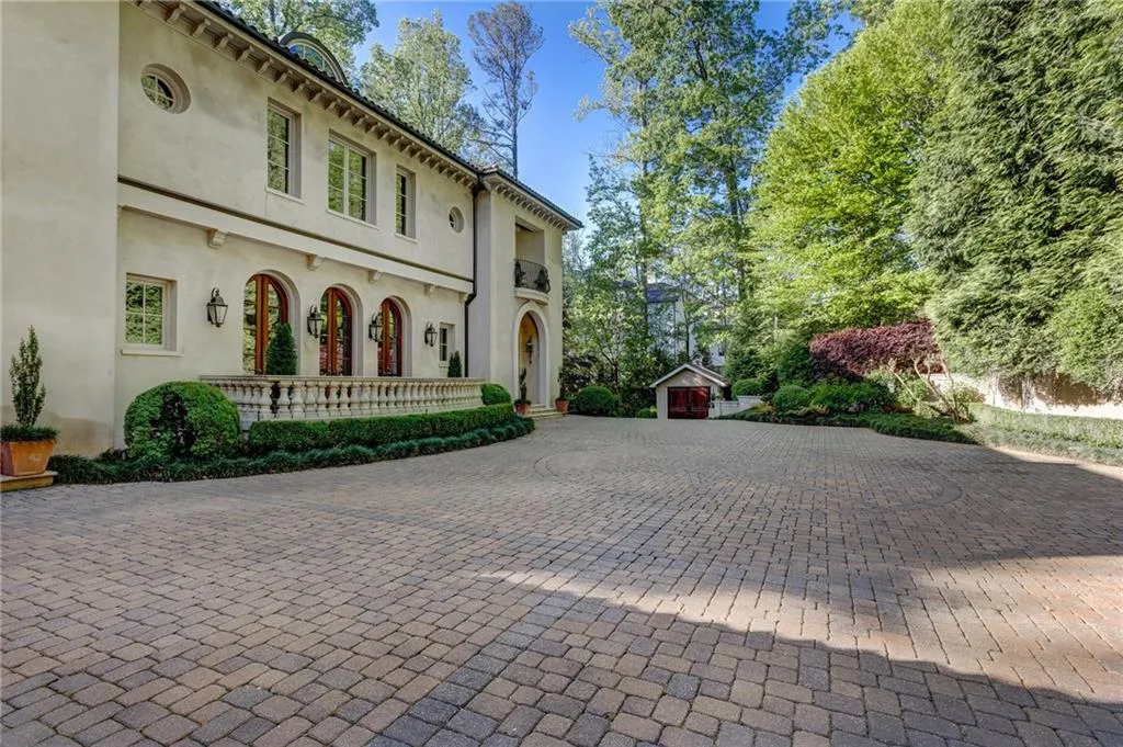 Cobblestone European courtyard. Separate small structure authentic to the property where original imported tiles are stored for the roof