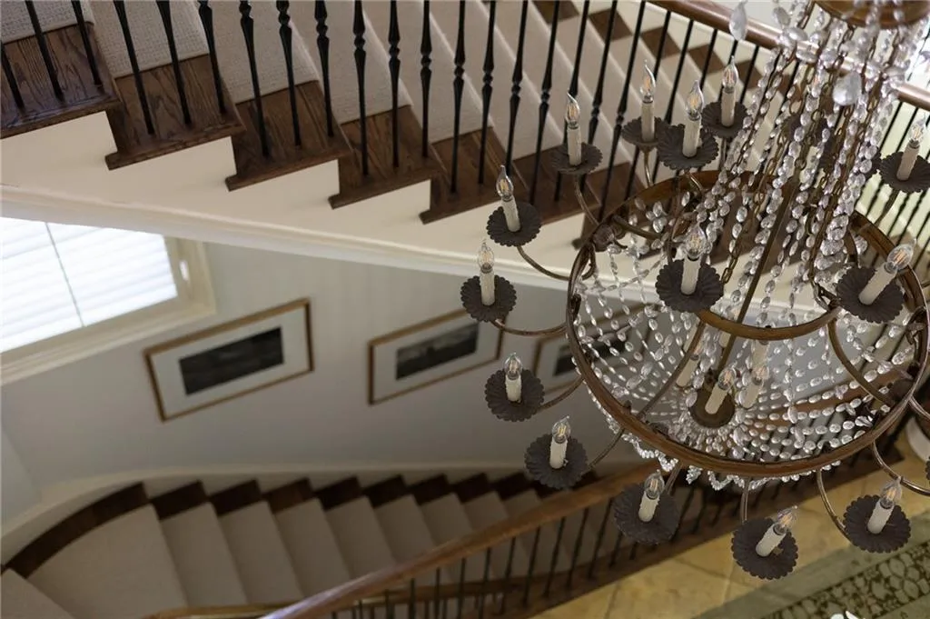 View of stairway with chandelier