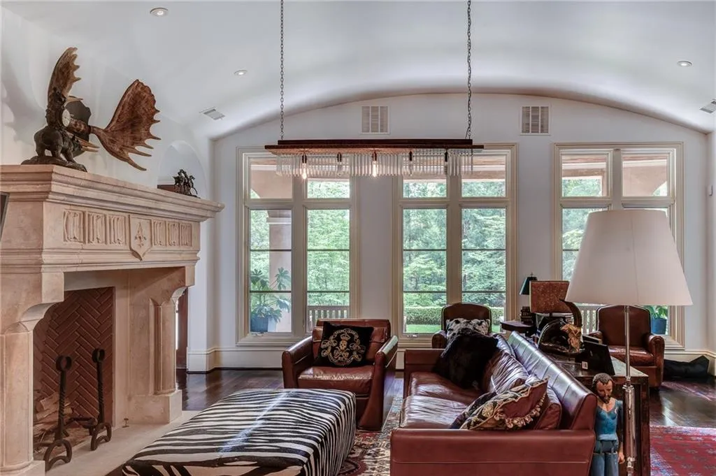 Terrace living room featuring hardwood / wood-style floors and vaulted ceiling