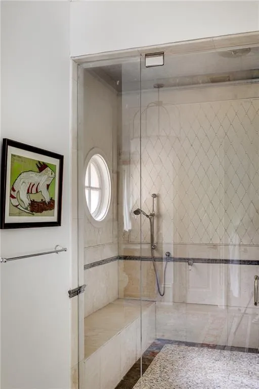 Bathroom with a shower with shower door