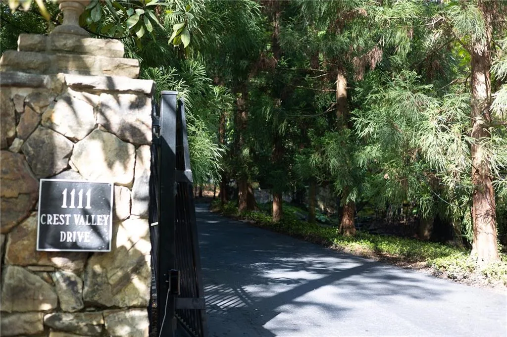 View of driveway and gate from street