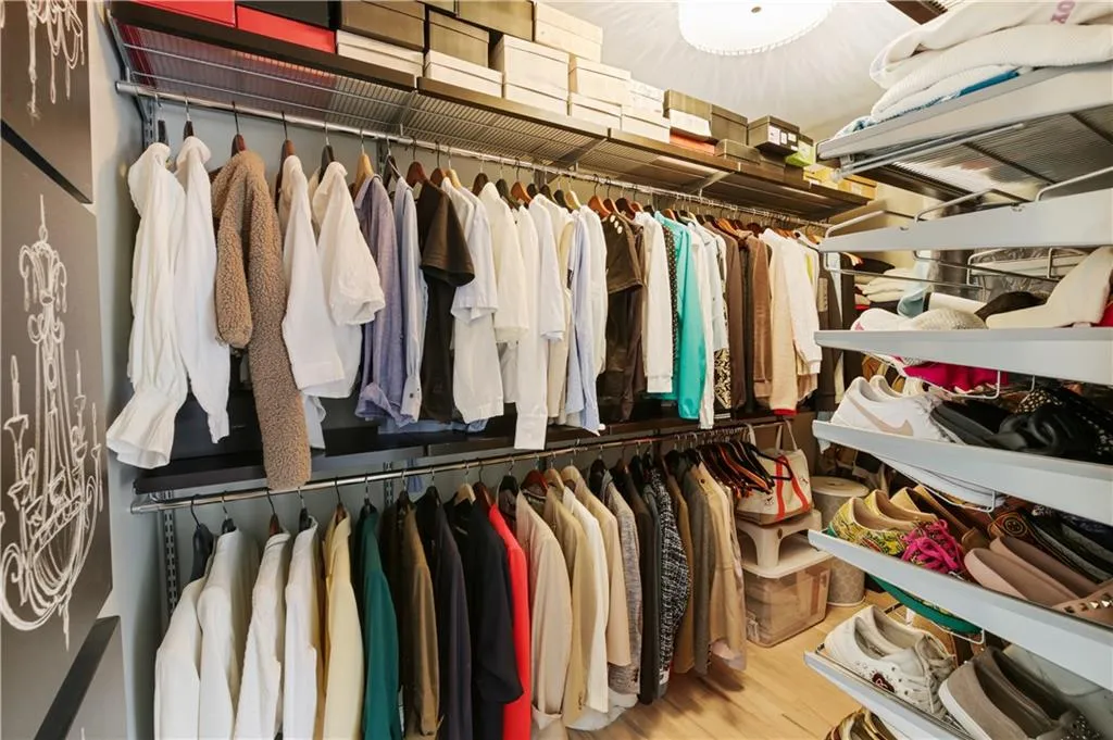 Spacious closet featuring hardwood / wood-style flooring