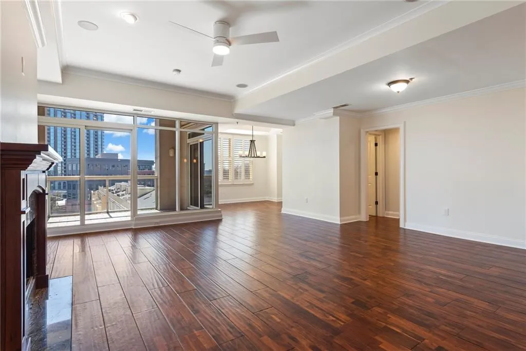 Wide Open floor plan showing living room, breakfast area, dining room, powder room
