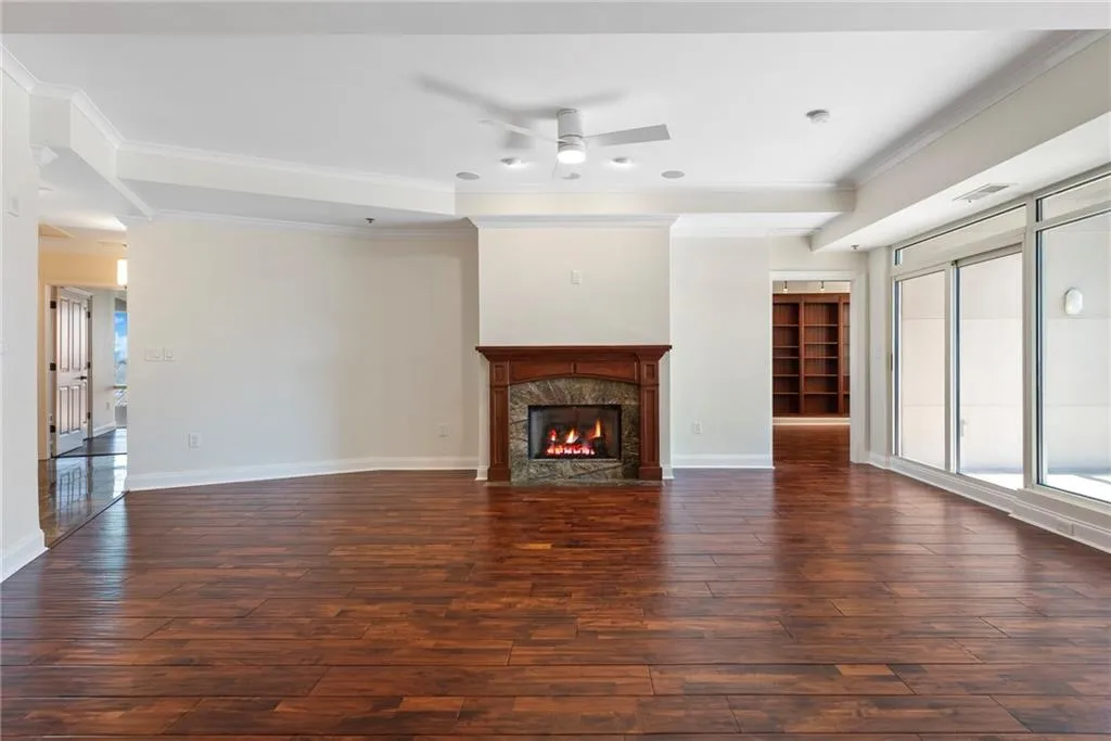 Marble surround on this gas fireplace. Balcony to the right