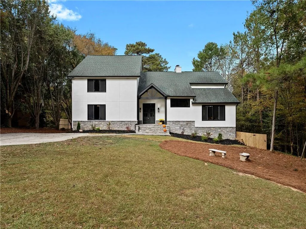 View of front of house with a front lawn