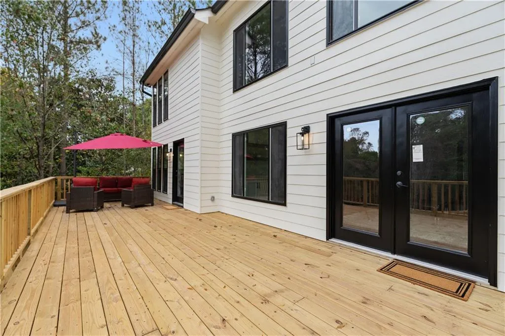 Deck featuring french doors and an outdoor hangout area