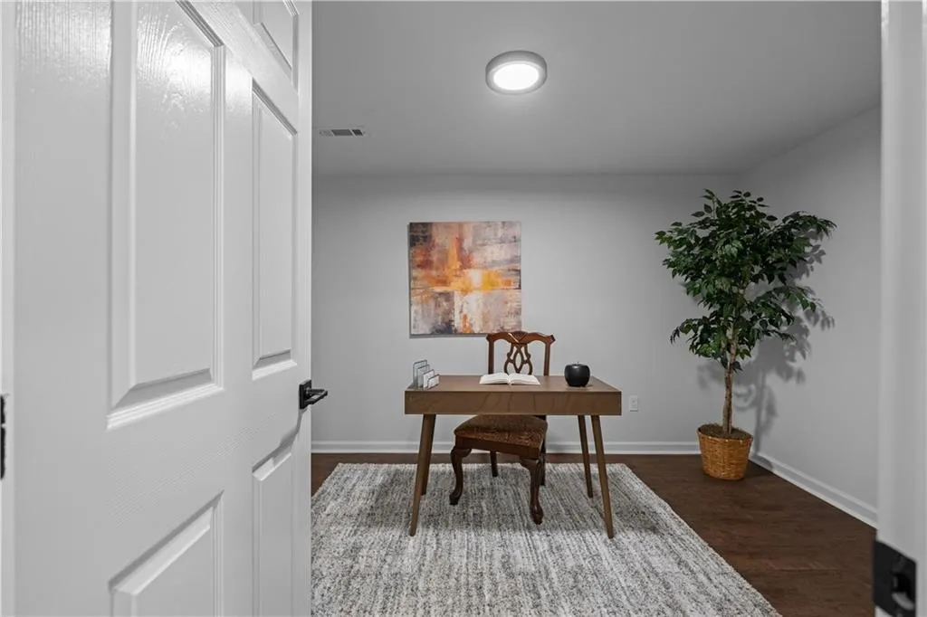 Office space featuring dark hardwood / wood-style floors