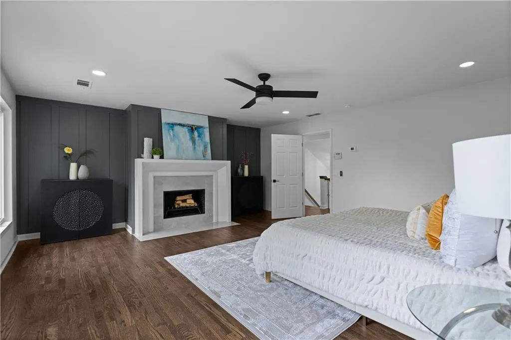 Bedroom featuring dark hardwood / wood-style flooring and ceiling fan