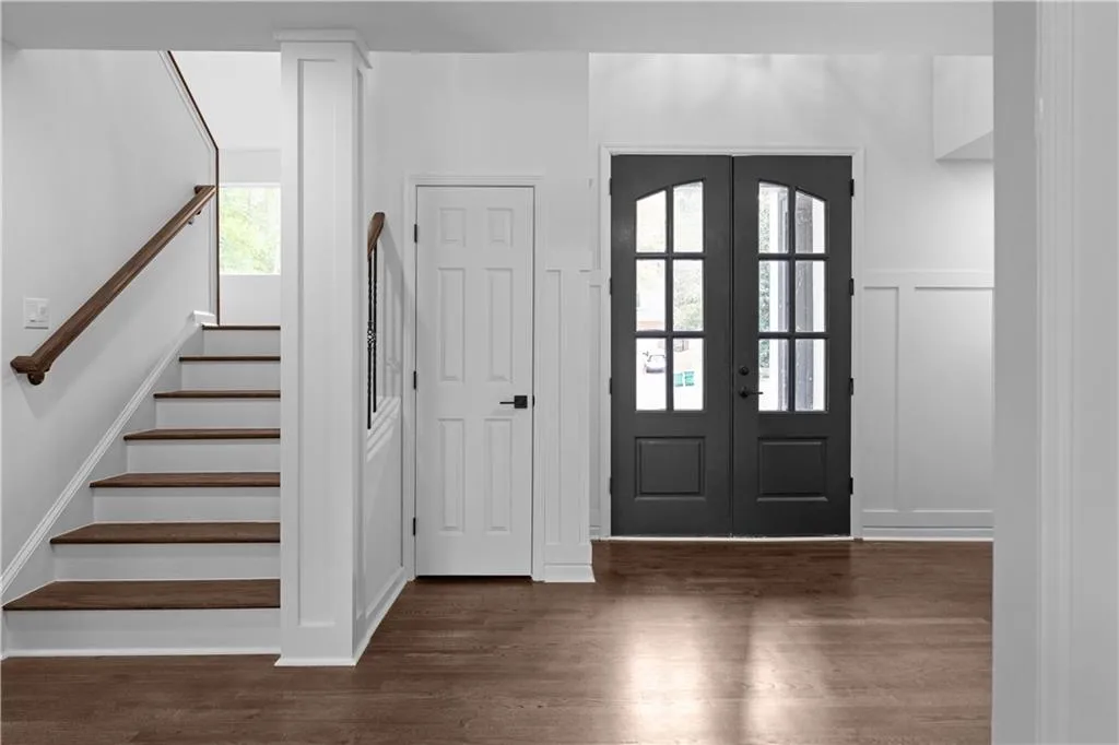 Entryway featuring french doors and dark hardwood / wood-style flooring