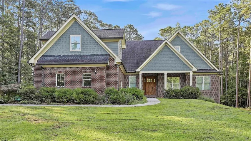 Brick and shingle exterior with gabled roof lines