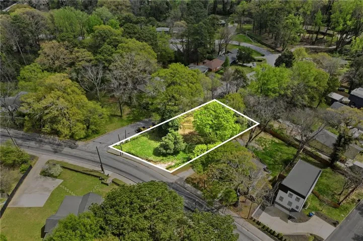 Aerial view of residential area with property parcel outlined