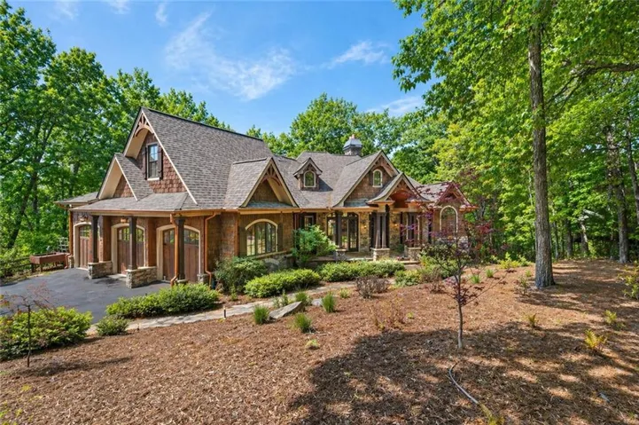 Craftsman-style exterior with natural wood shingles and stone accents