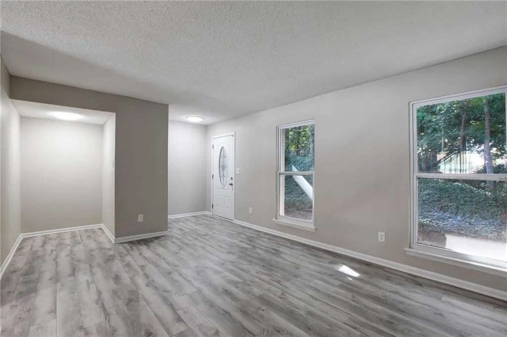 Foyer featuring wood finished floors and a textured ceiling
