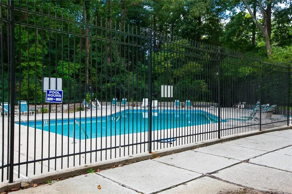 Community pool featuring a patio
