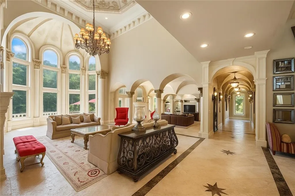 Community lobby with a towering ceiling and recessed lighting