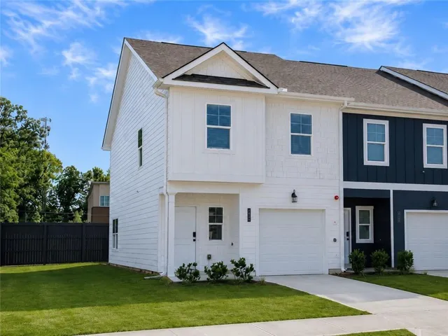 Crisp white siding exterior with shake accents