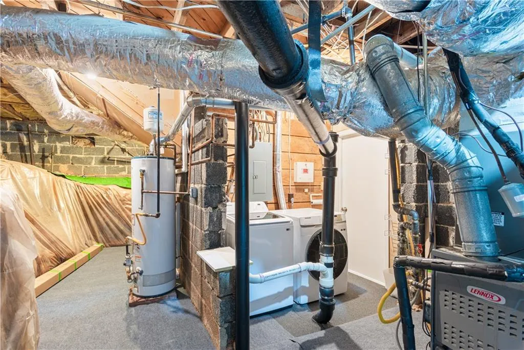 Storage and laundry in unfinished portion of basement.