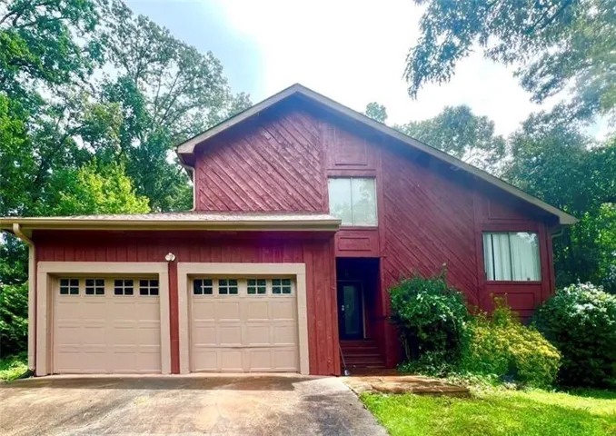 Red siding exterior with a prominent A-frame roofline