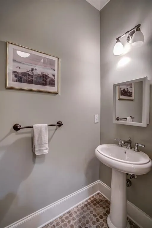 Bathroom featuring baseboards and tile patterned flooring