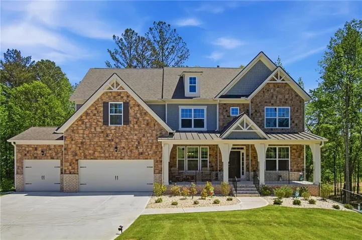 Stone and siding exterior with gabled roof lines