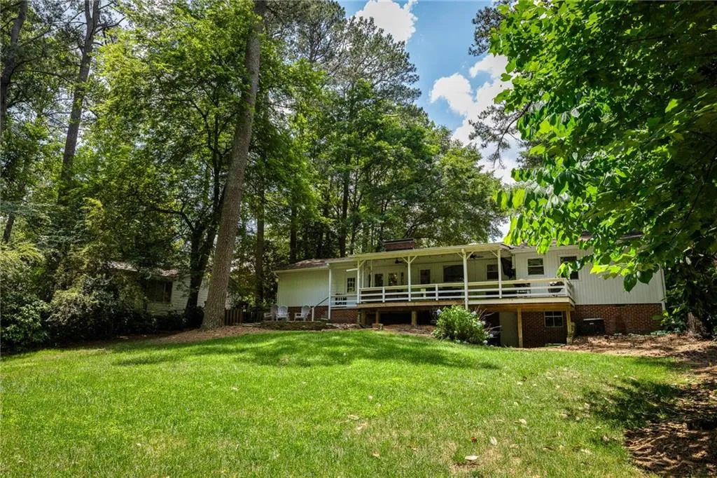 Back of house featuring a lawn