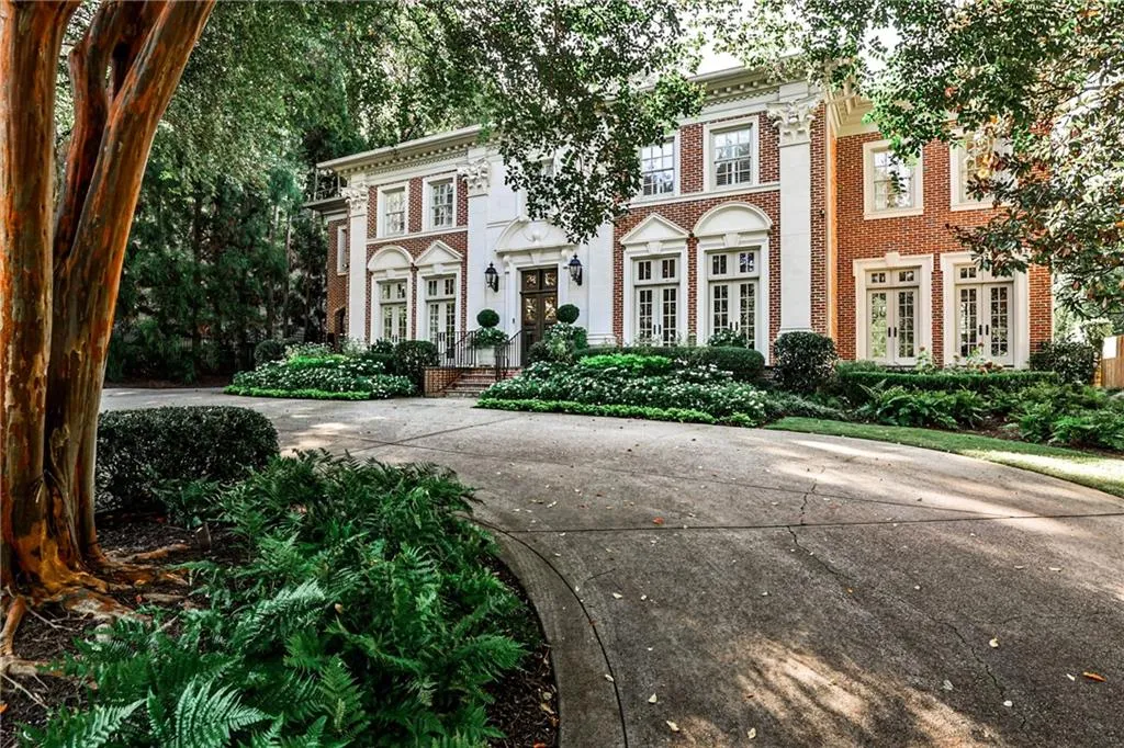 View of front of home with brick siding and french doors