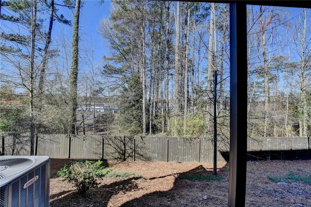 View of yard featuring a fenced backyard and central AC