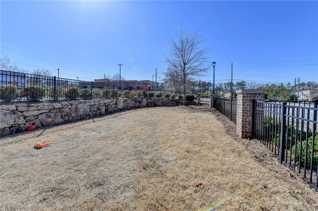 View of yard featuring fence