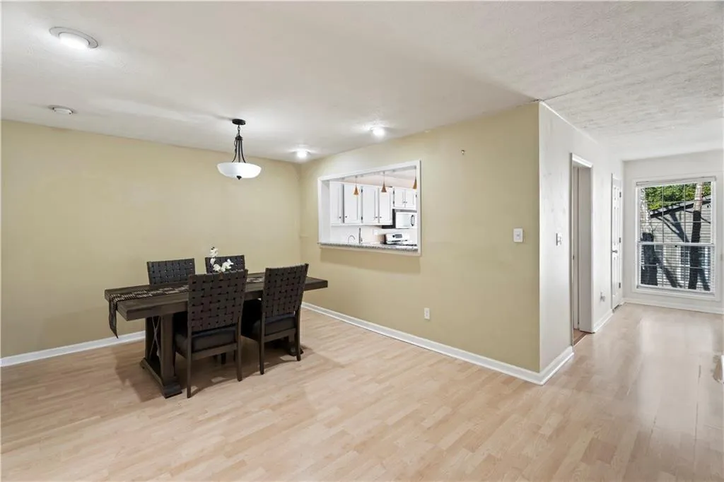 Dining area featuring light wood-type flooring Dining area featuring light wood-type flooring