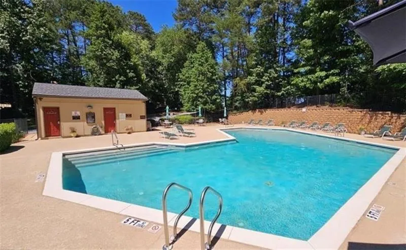 Community pool featuring a patio area