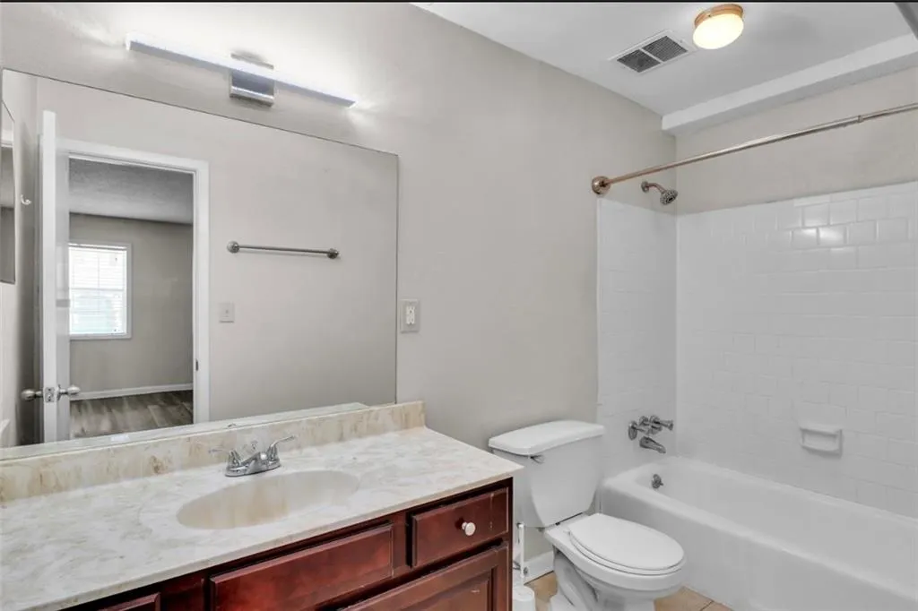 Full bathroom featuring vanity and shower / bath combination