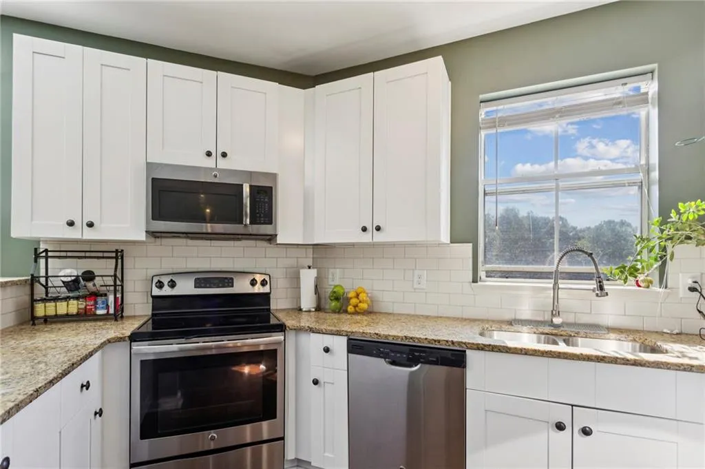 Renovated Kitchen which features extended counter space and modern finishes