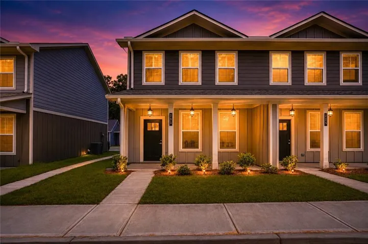 Contemporary multi-unit residence with dark gray siding and white trim