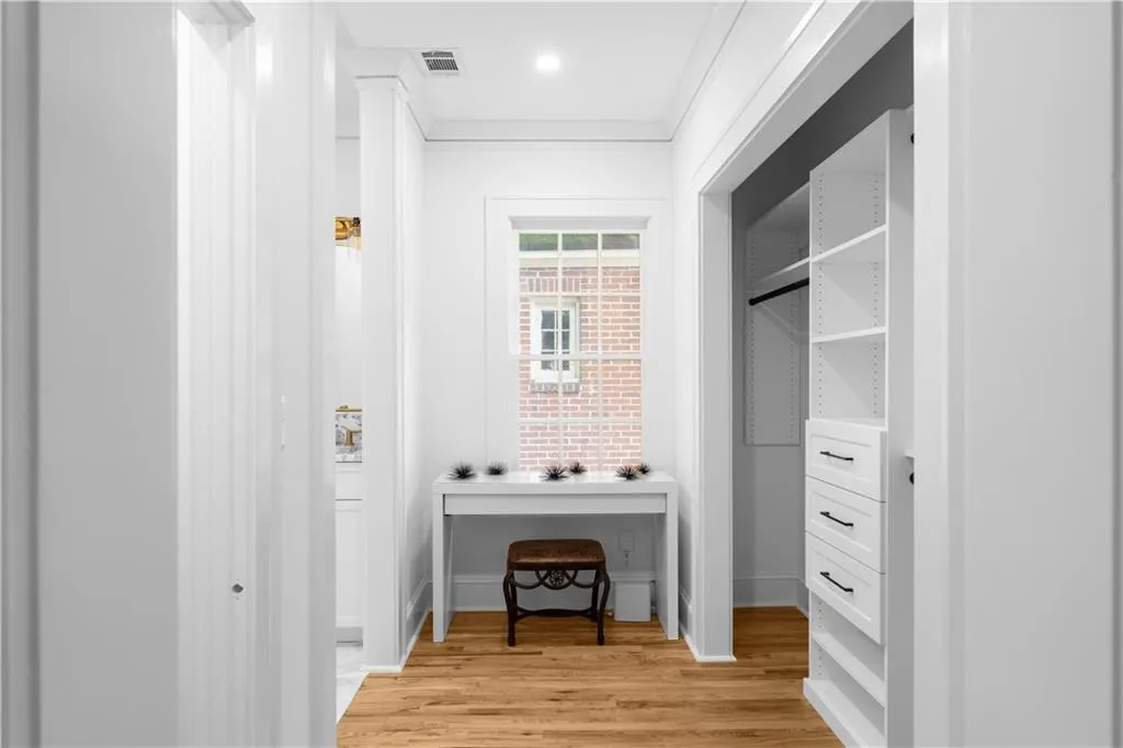 Walk in closet featuring light wood-style floors