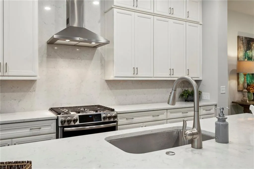 Stainless steel appliances. Hooded vent is perfect for those cooking your aromatic meals.