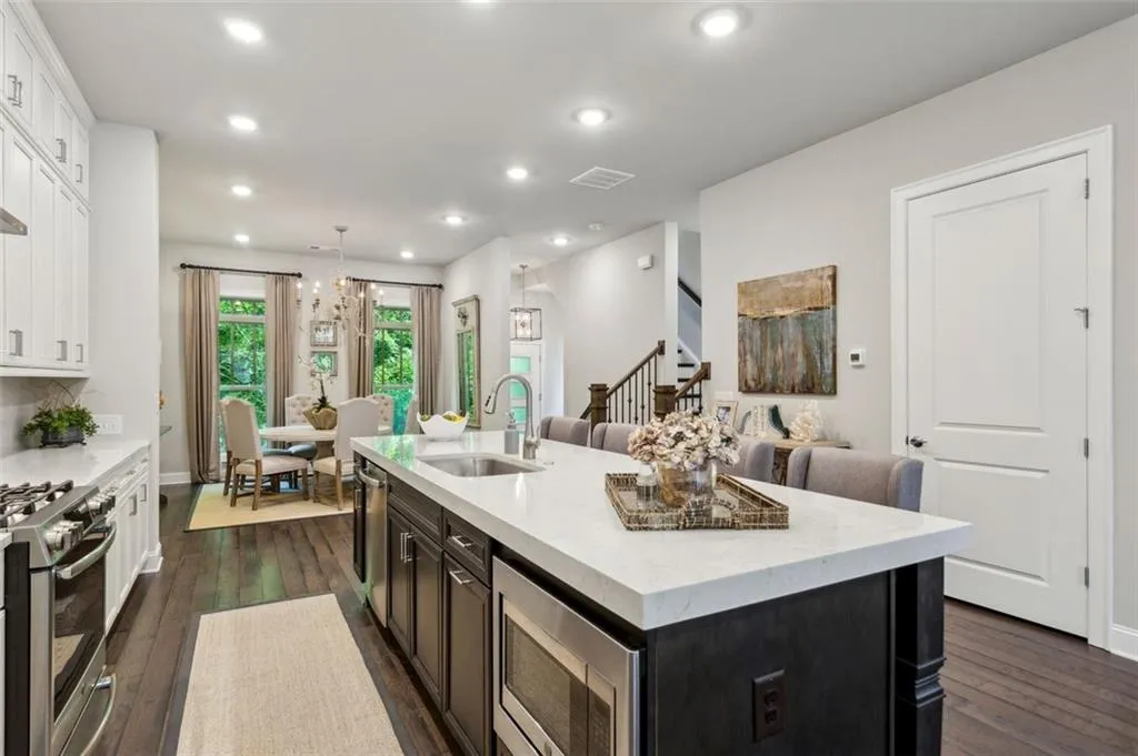 Open concept on the main level. Due to the size of the home, you have a kitchen, formal dining room. living room and sitting/breakfast area all without feeling cramped.