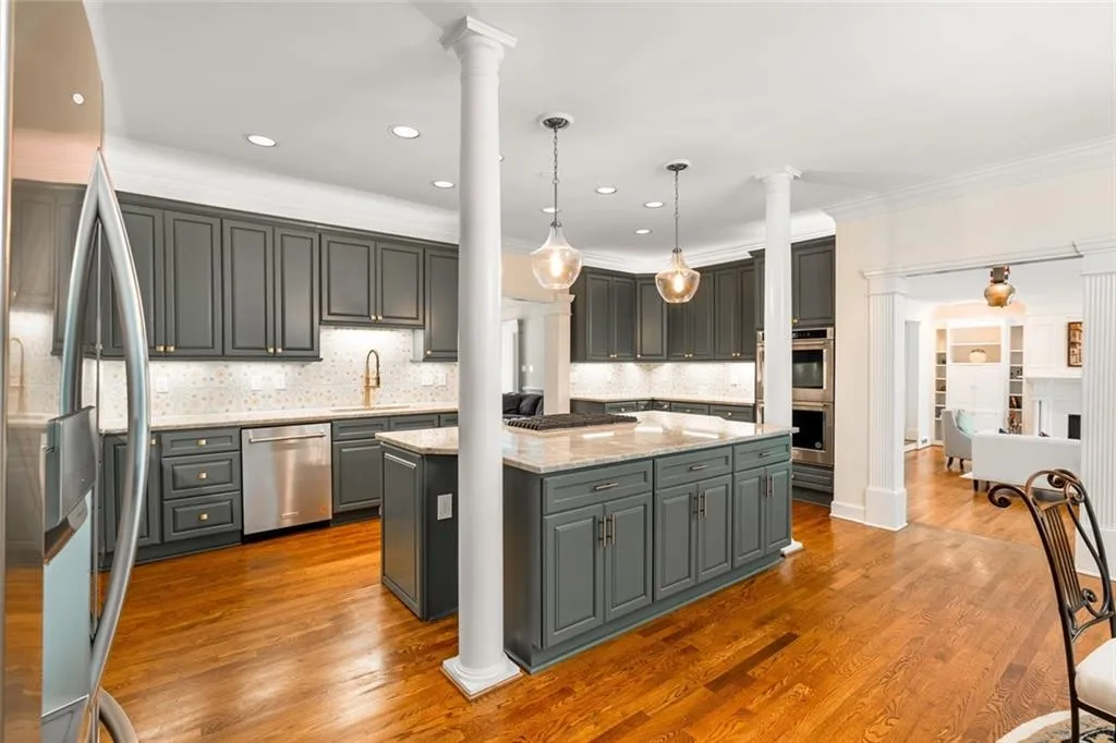 The Chef Kitchen features all new custom cabinetry, Vancouver quartzite countertops, oversized island, premium KitchenAid appliances, and a built-in coffee station