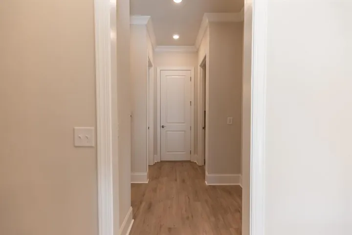 leading to the primary bedroom on main floor - Pictures are for representation only, not the actual home, home is a TO BE BUILT