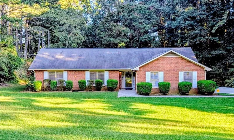 Brick exterior with white shutters