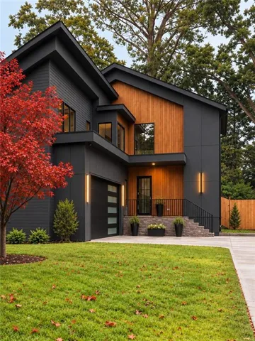 Modern exterior with dark siding and natural wood paneling