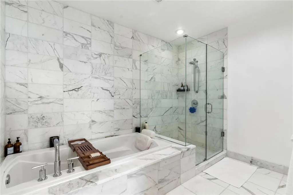 Bathroom with a marble finish shower, a bath, tile patterned floors, and recessed lighting